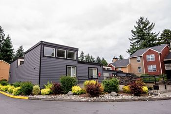 the exterior of a house with a yard in front of it